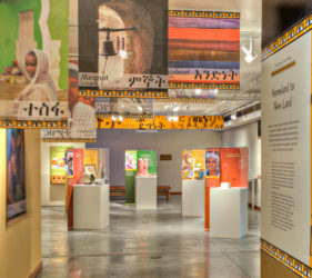 Entry into exhibit space with colorful banners overhead